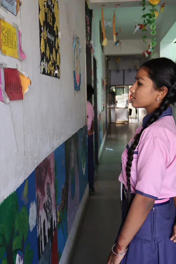 A student looking at artwork