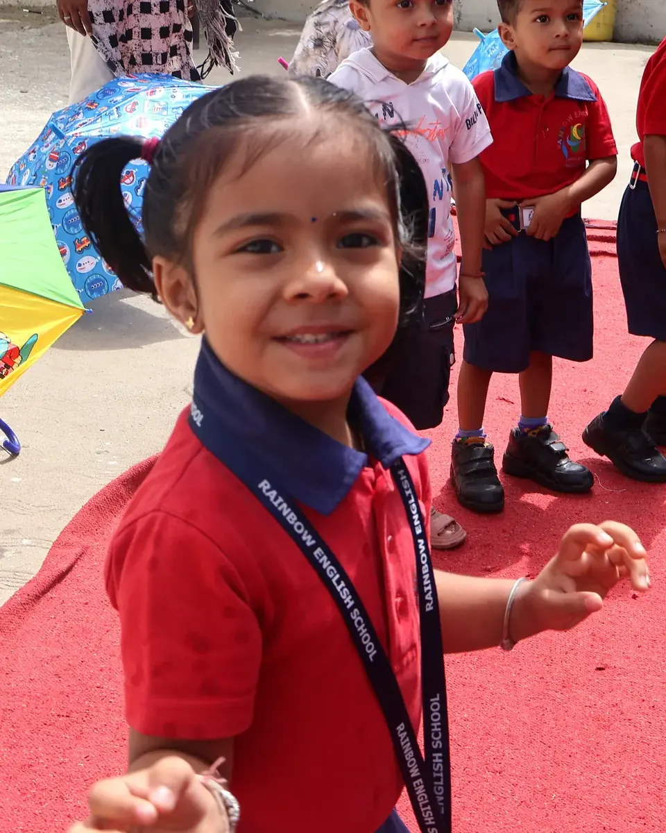 A smiling nursery student at Umbrella Day